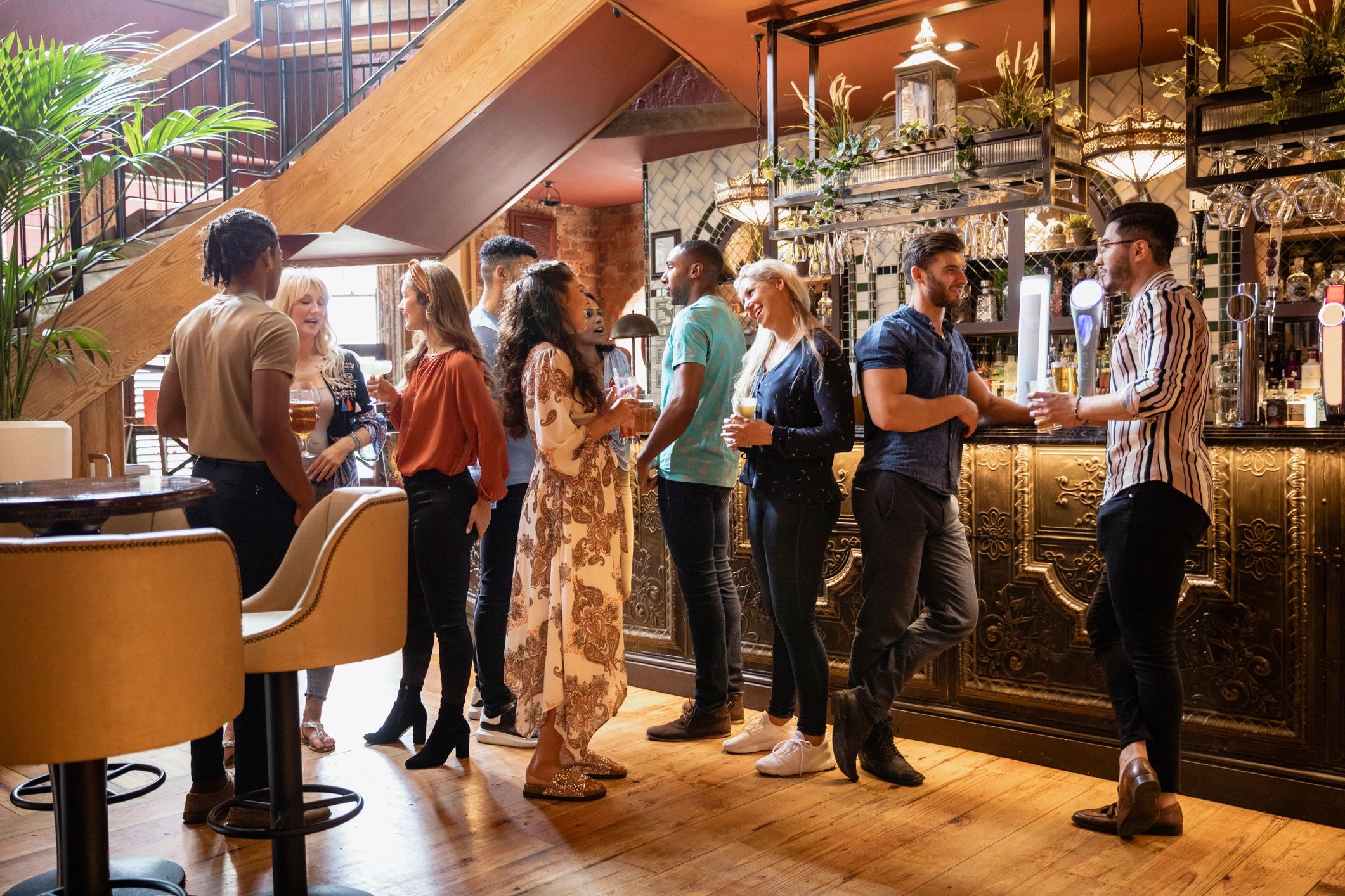 Passengers enjoying drinks together at a cruise ship bar