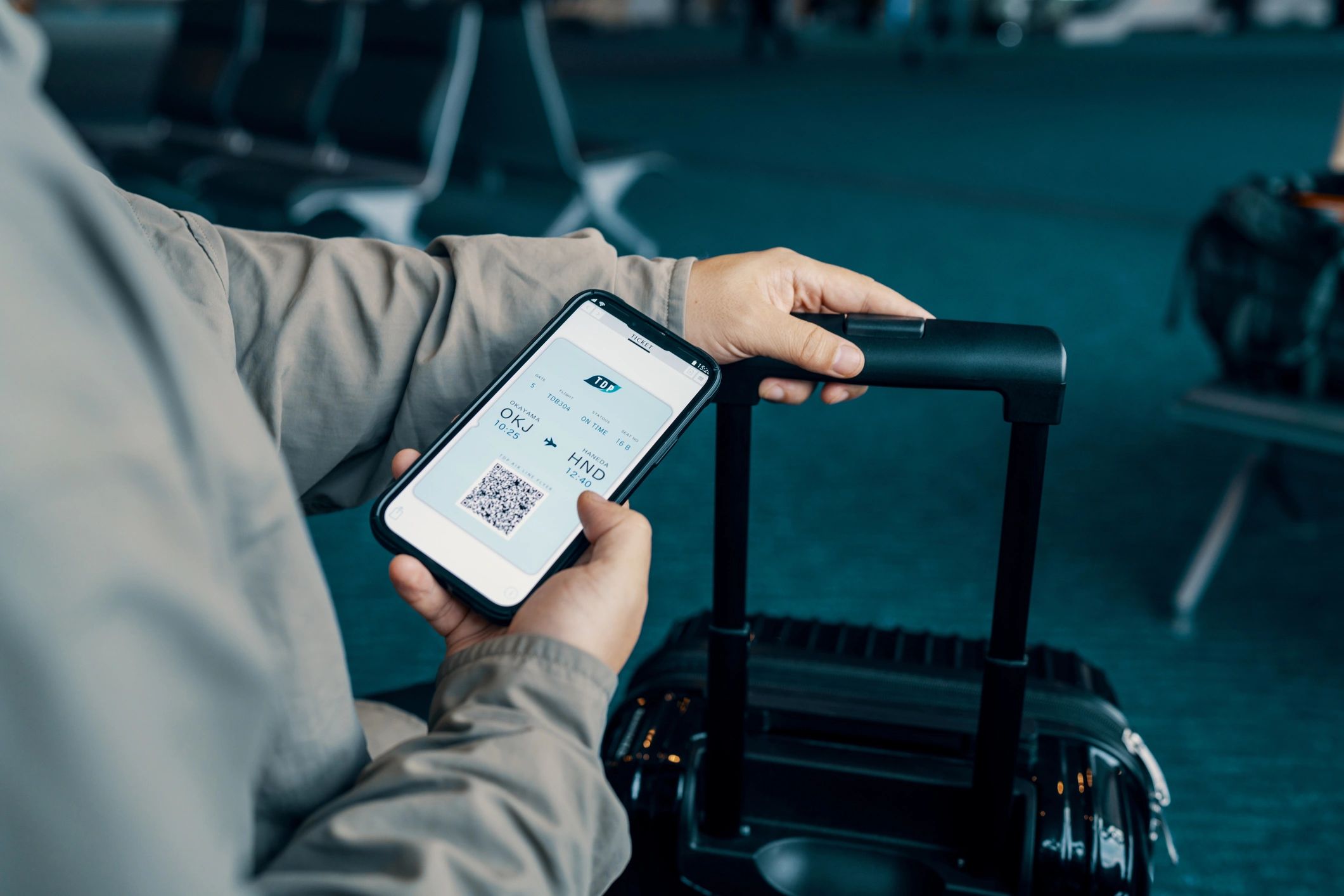 Traveler checking an electronic ticket on a smartphone before departure