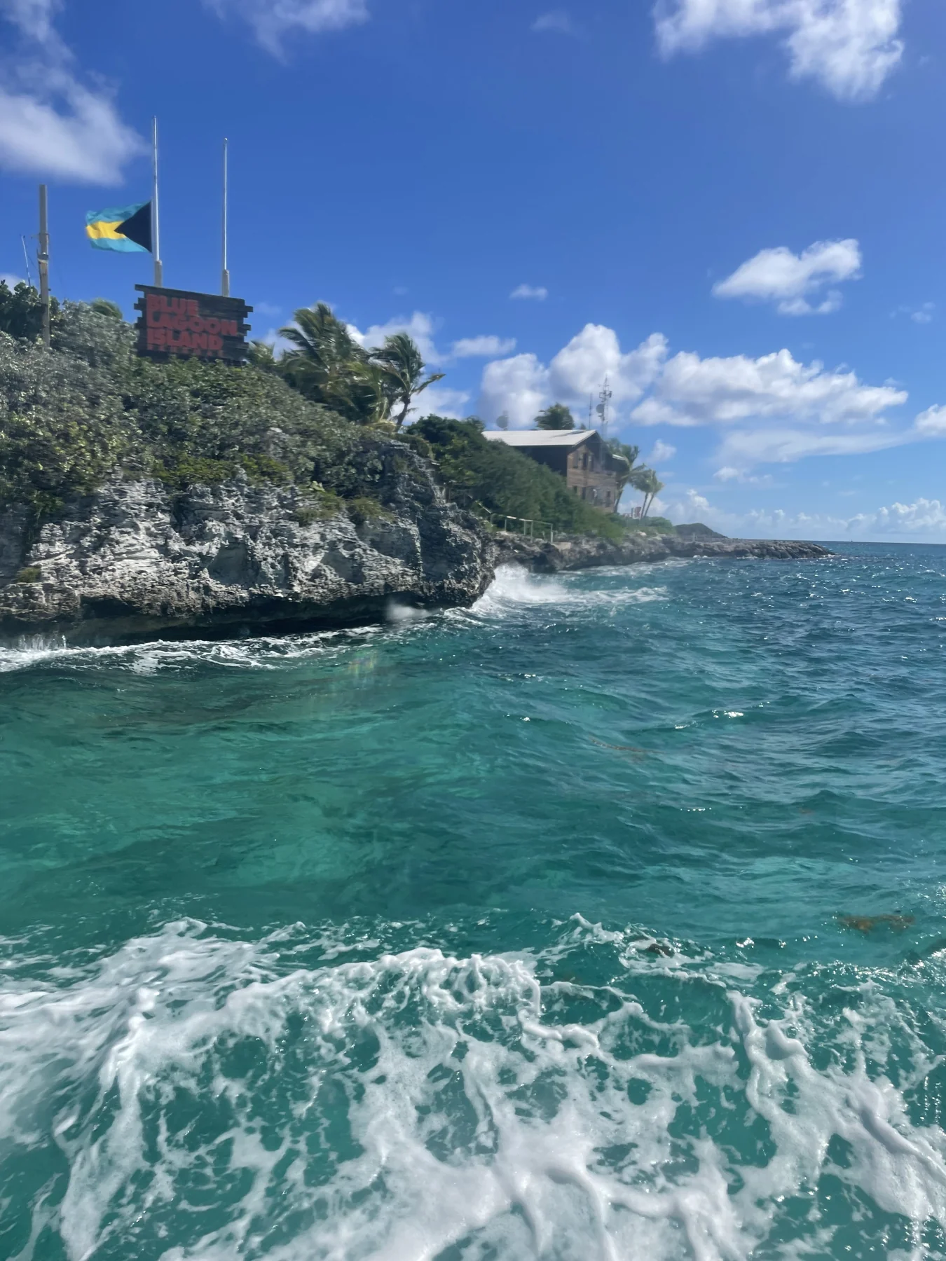 Turquoise water and the shoreline at Blue Lagoon Island, photographed during Kevin and Amy’s travels